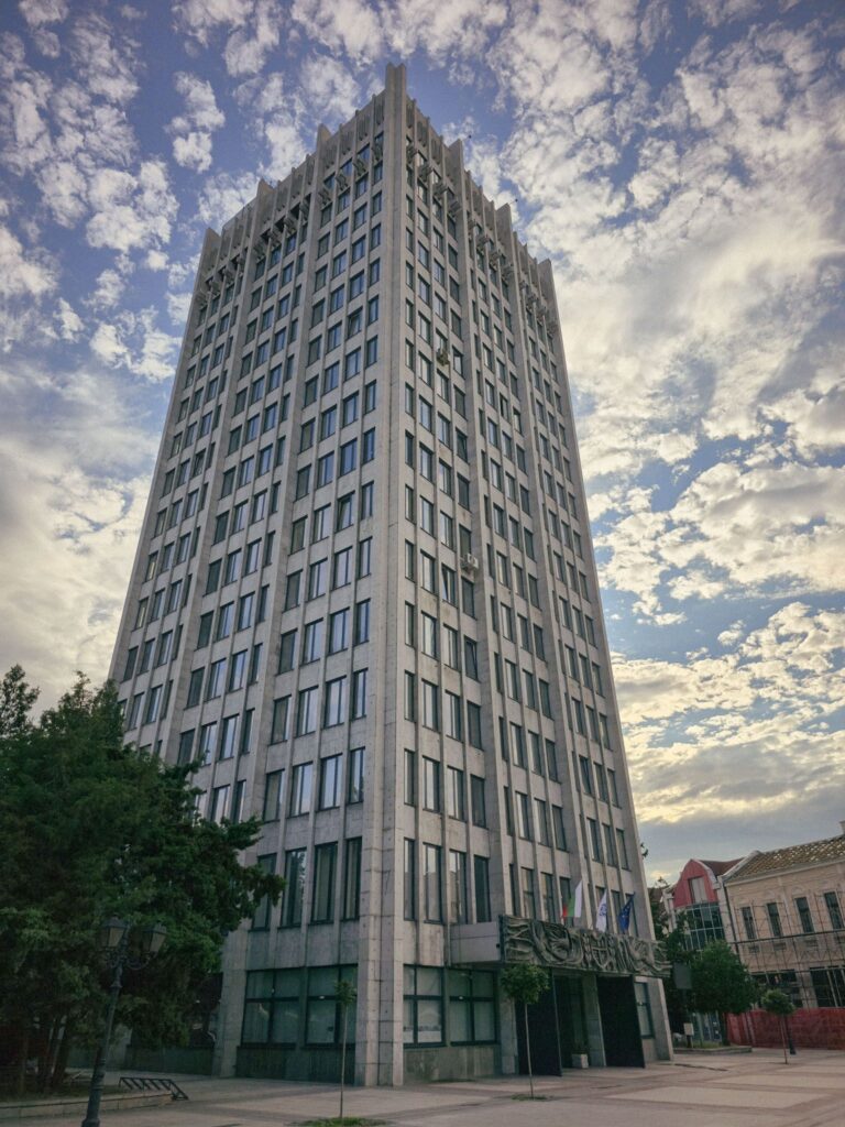 The brutalist building of the municipality against the clearing sky in Vidin, Bulgaria