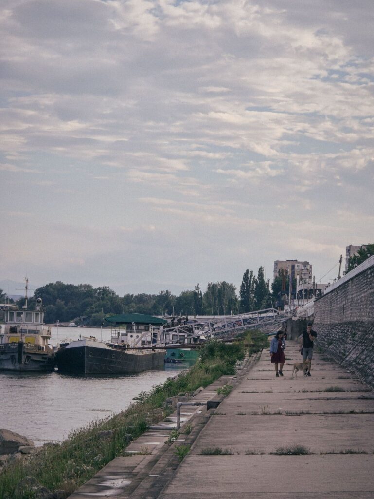 A couple walking down the Danube promenade in Vidin, Bulgaria